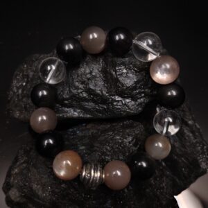 12mm skeletal stone, clear quartz, black obsidian, 37 grams, 16cm 17cm in diameter.